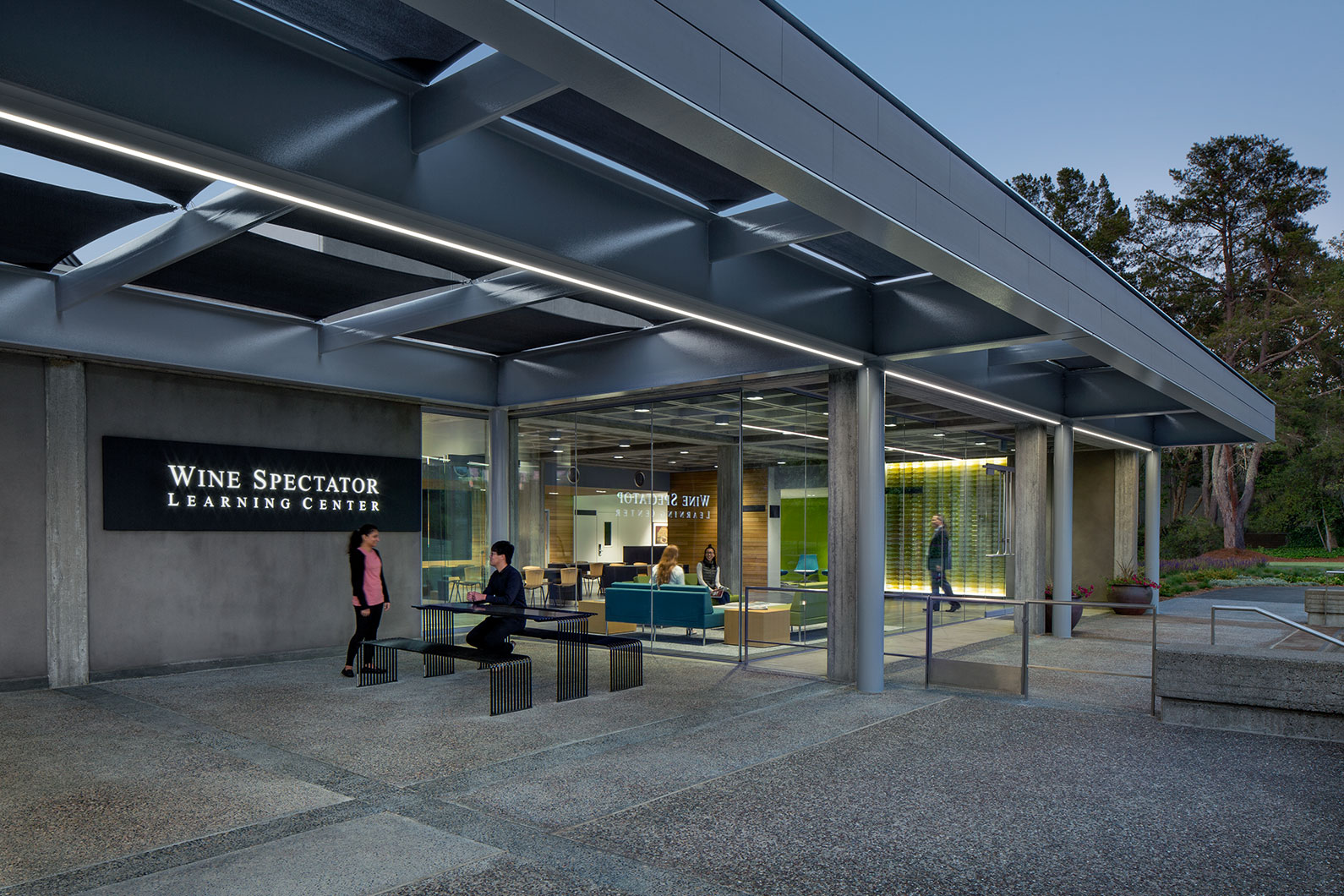 People gathering outside at dusk at Wine Spectator Learning Center, Sonoma State University