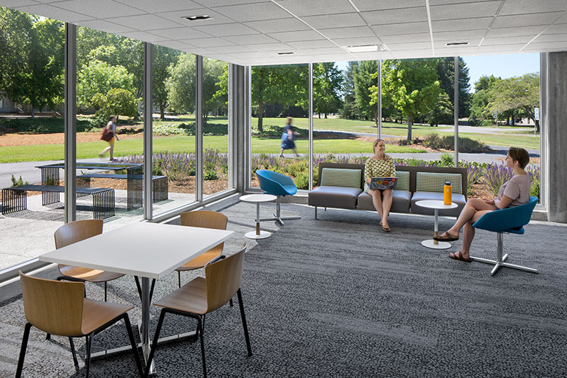 Two women in causal gathering space at Wine Spectator Learning Center, Sonoma State University