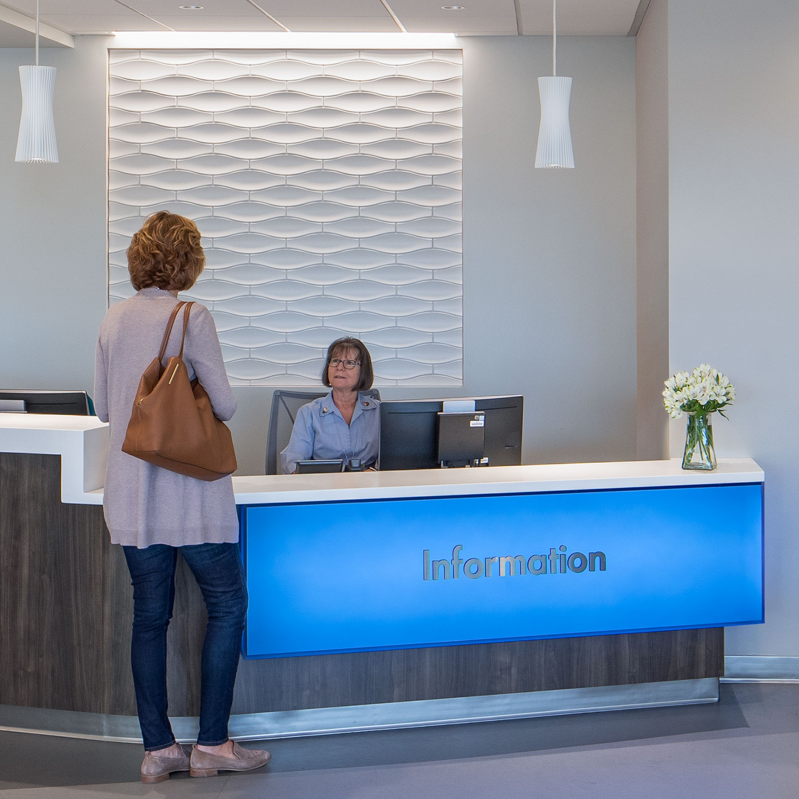 Two women at reception desk at Kaiser Permanente Santa Rosa Lobby