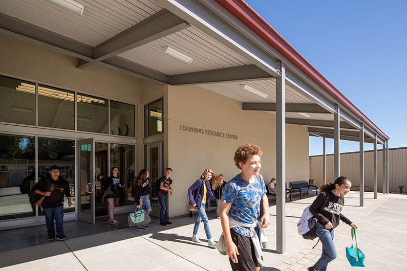 Students walking out the entrance of Learning Resource Center at Terrace Middle School