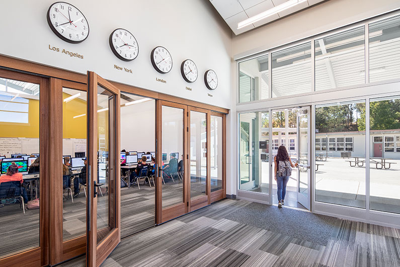 Interior photo of Learning Resource Center with wall of doors that separate computer lab