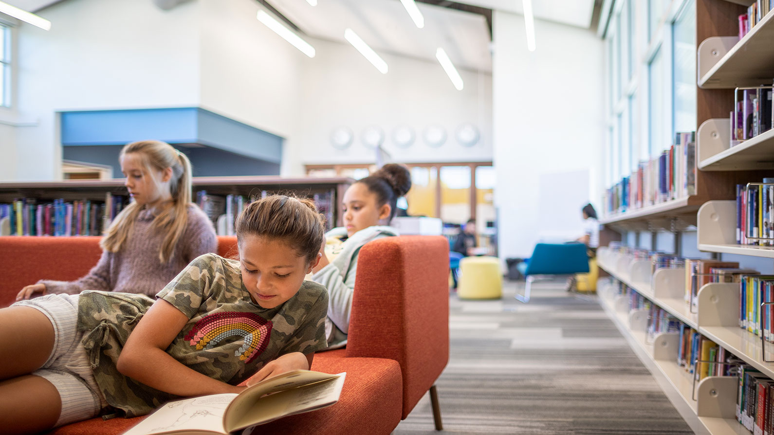 Several female students working at desk in Learning Resource Center