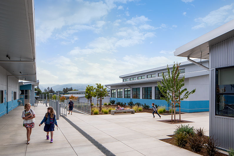 Elementary students walking between two buildings at Irene Snow Elementary