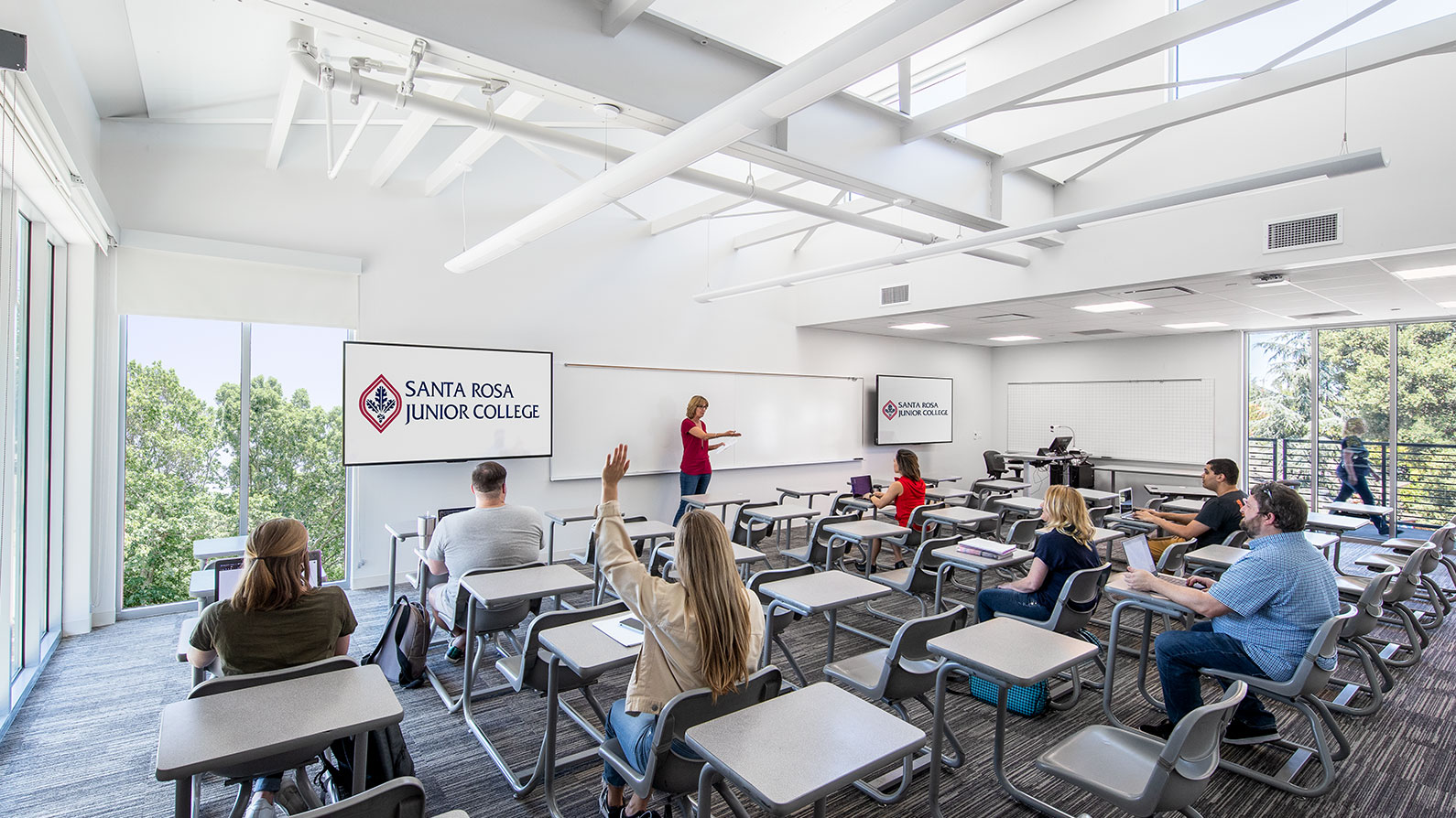 Interior view of classroom with teacher and students