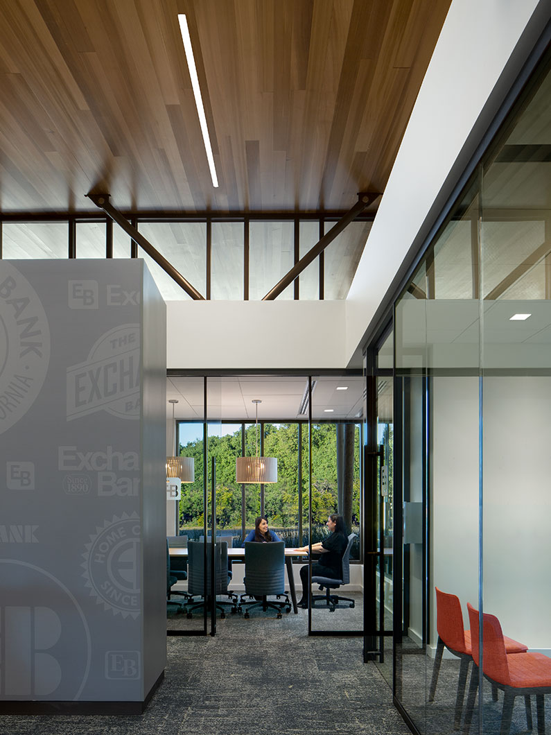 Two people sitting in conference room at Exchange Bank Sebastopol Branch