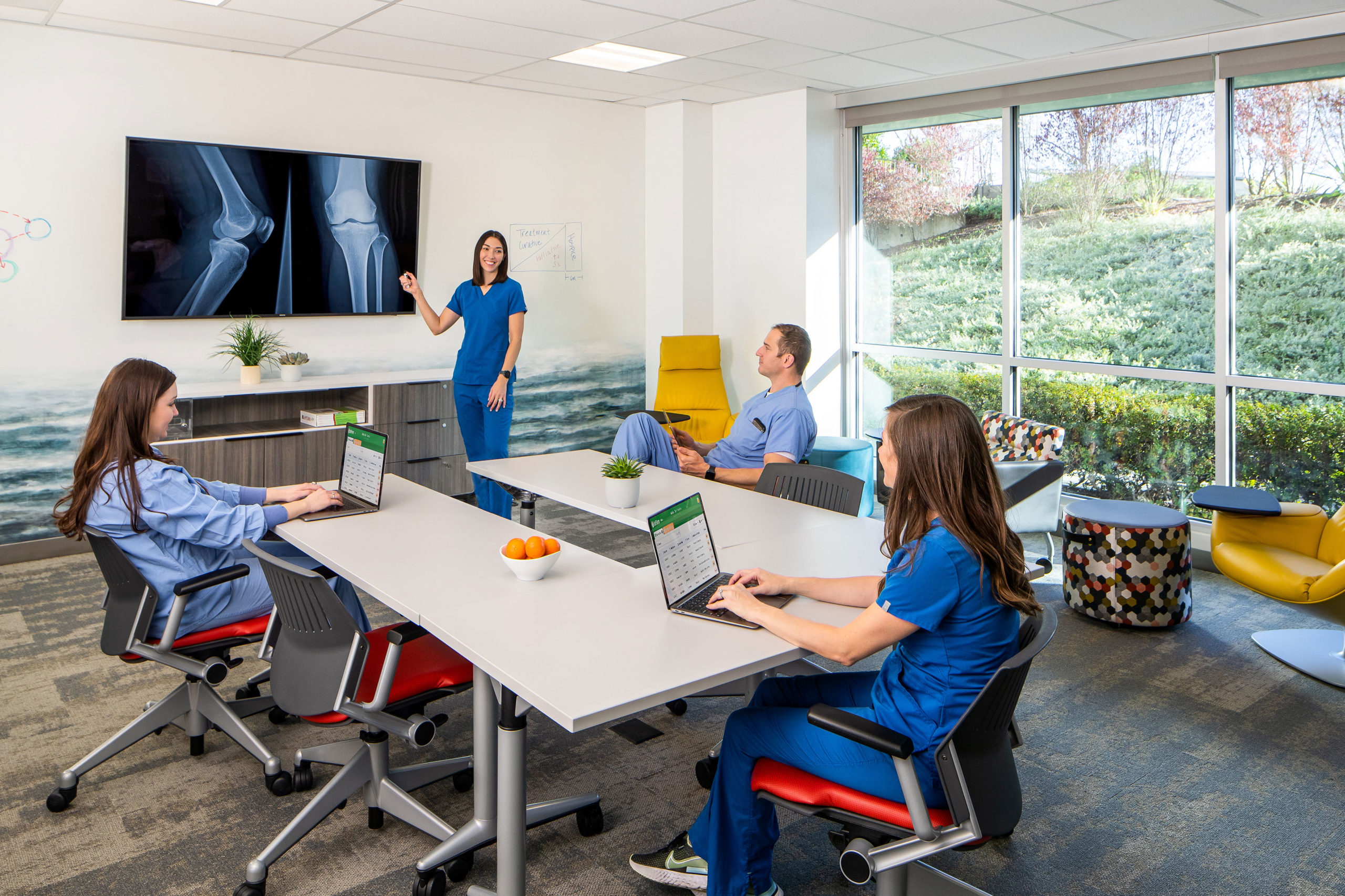 Group of doctors looking at xrays on screen in Family Residency suite