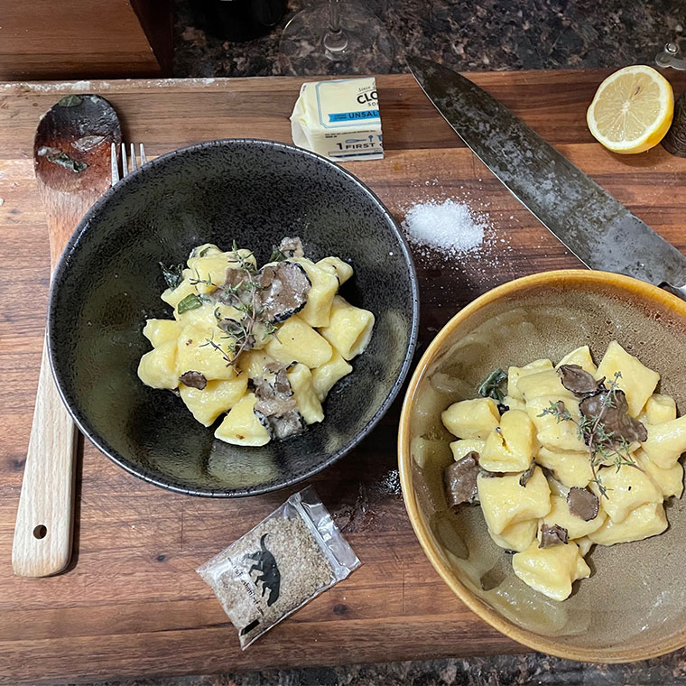 Plates with gnocchi from online cooking class