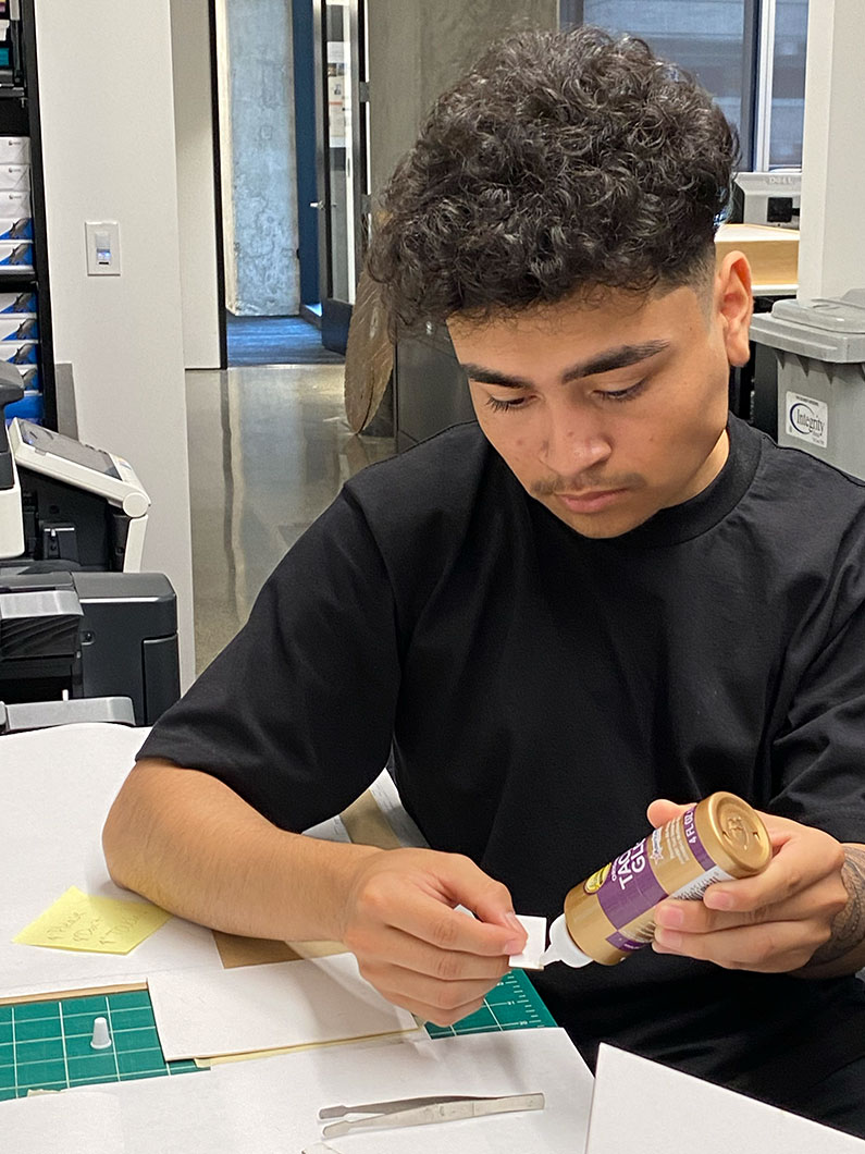 Summer intern working on a building model