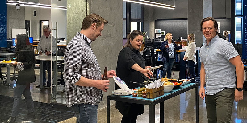 Staff from TLCD Architecture getting food at Wine Wednesday