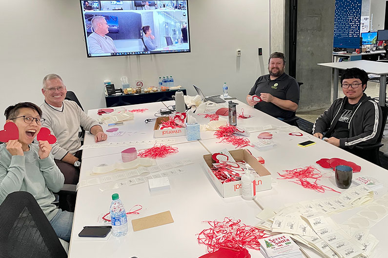 TLCD staff assembling hearts for charity