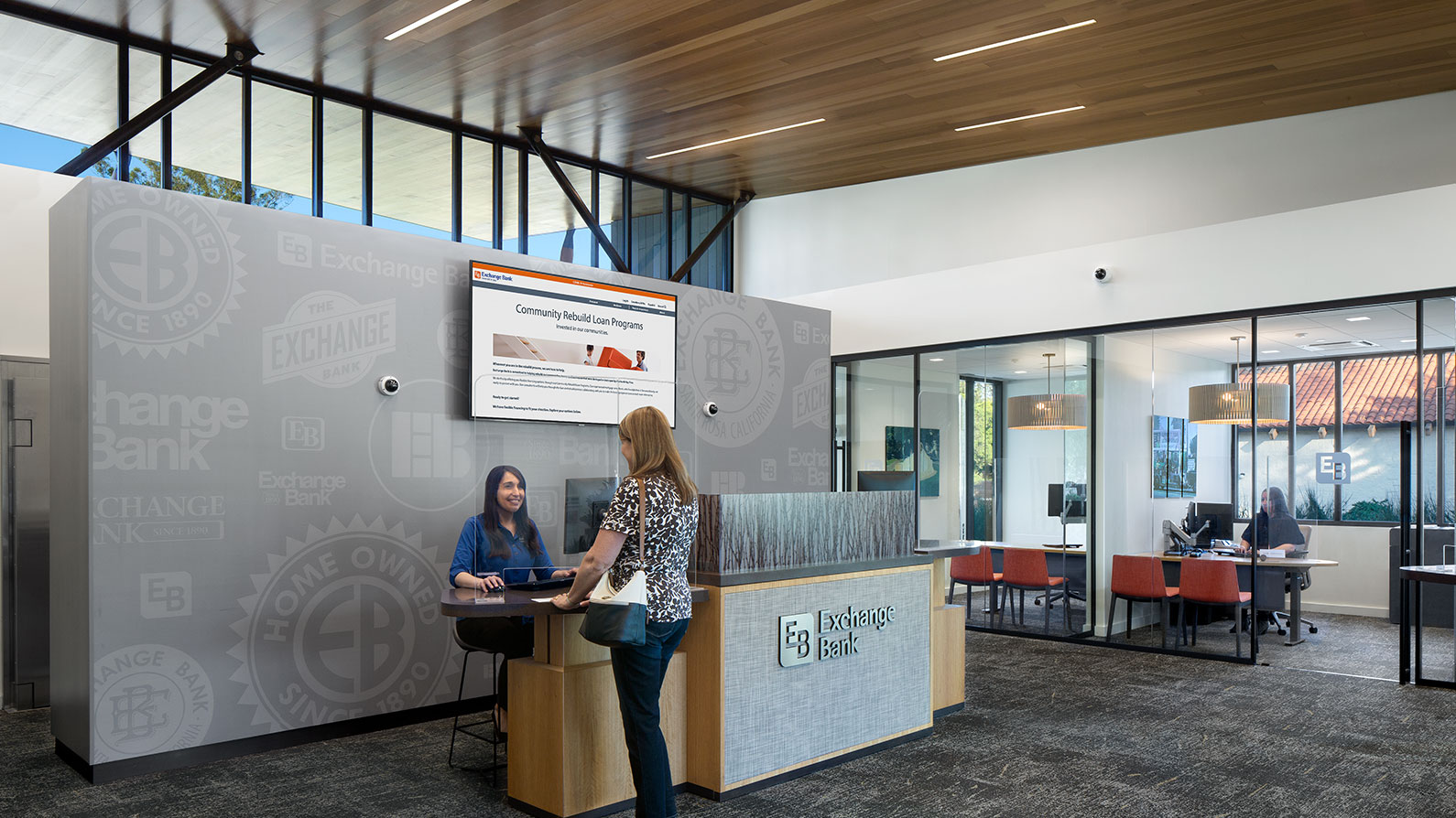 Exchange Bank customer talking to teller