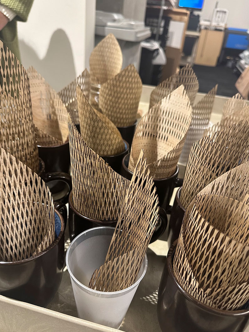 Laser cut plywood forms in cups