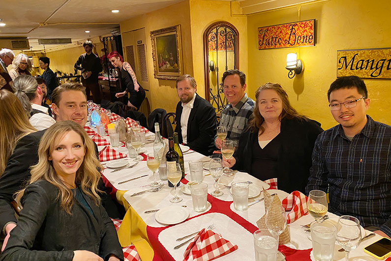 TLCD staff gathered at a table for holiday party