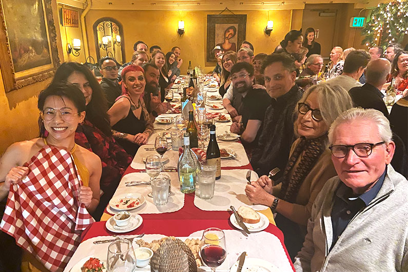 TLCD team sitting at table for holiday party