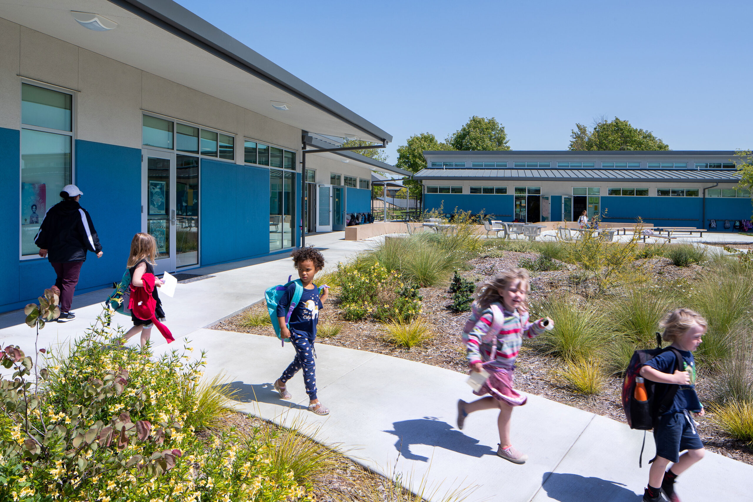 K-12 Education Architecture, new classroom building. Students leaving their classroom at Loma Vista Immersion Academy in Petaluma, CA