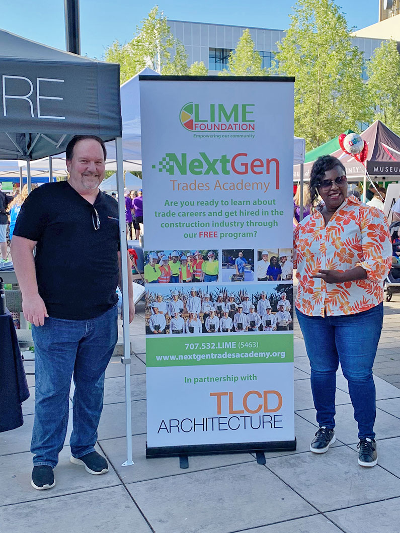 Jason Brabo and Letitia Hanke standing by banner for LIME Foundation