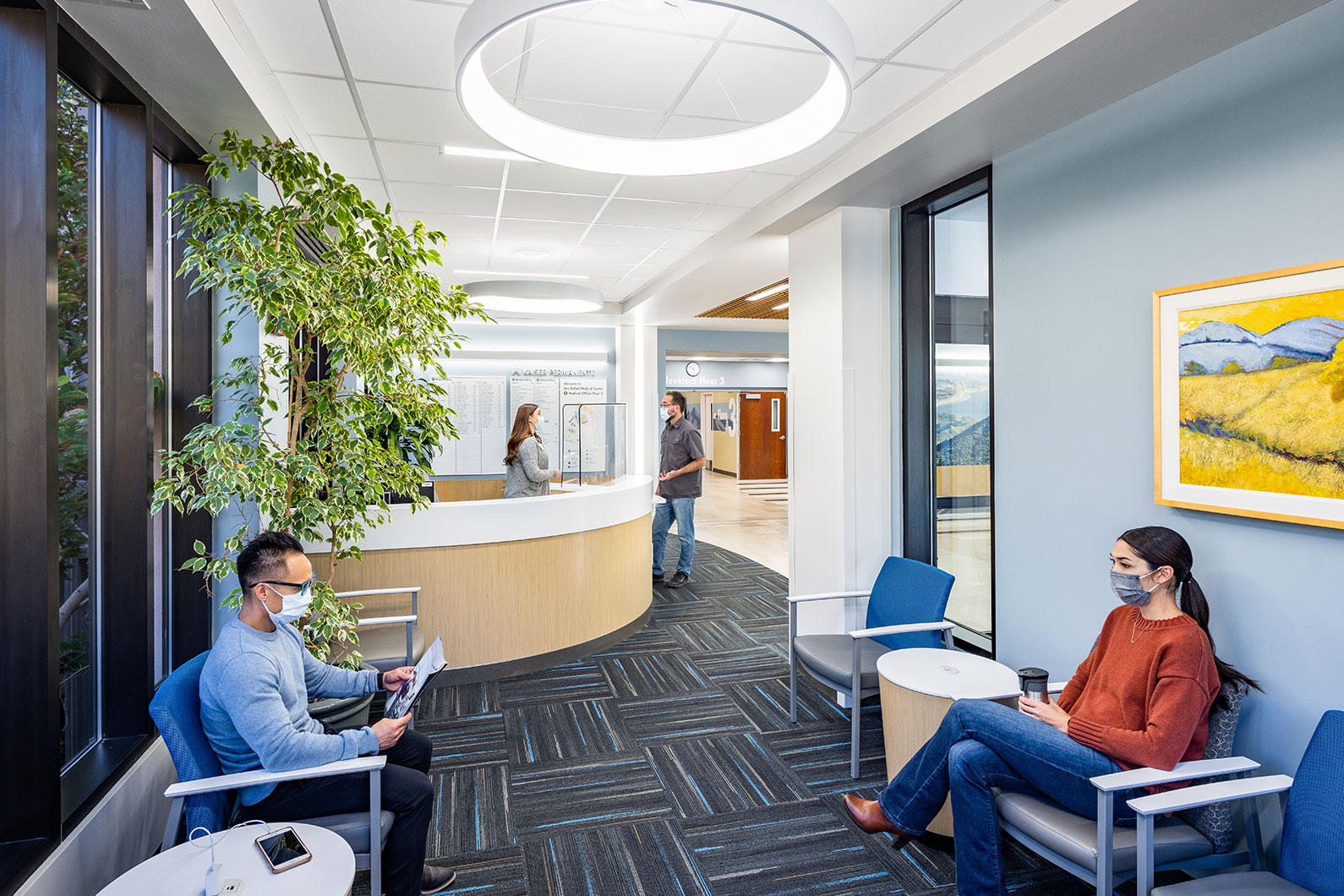 Several people sitting in lobby at Kaiser Permanente San Rafael Lobby