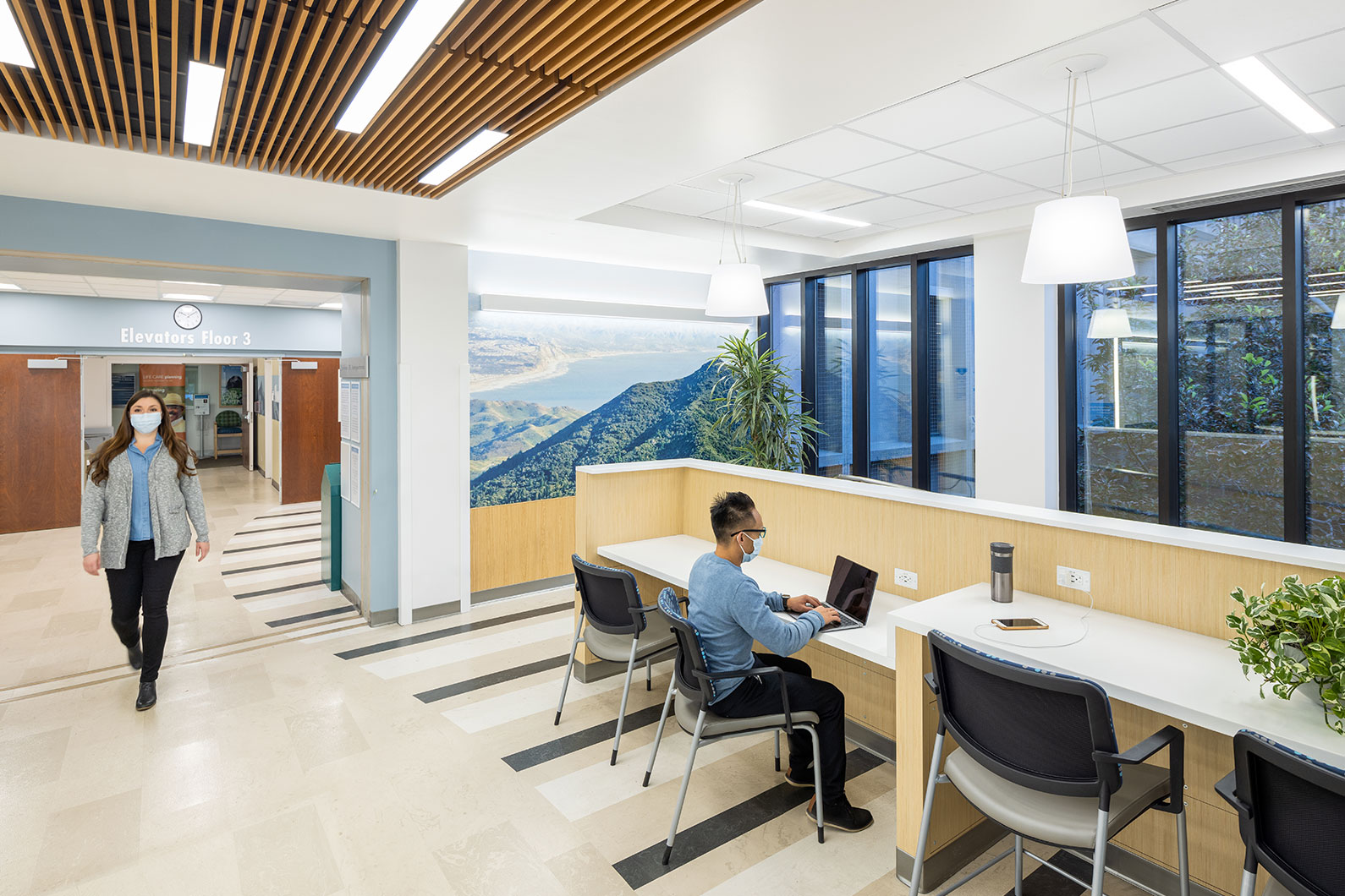 Man sitting at work station at Kaiser San Rafael lobby