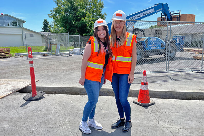 Kiely Rowe with High School student at job site