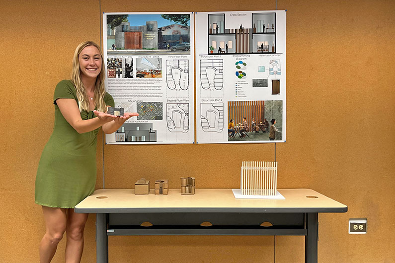 Kiely Rowe showing architecture project in school
