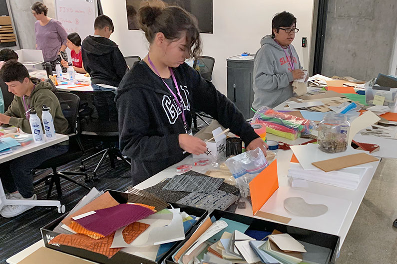 Middle School student gathering supplies for STEM project