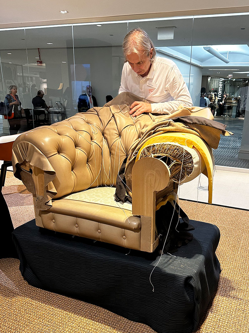 Craftsman working on a chair at Neocon 2023