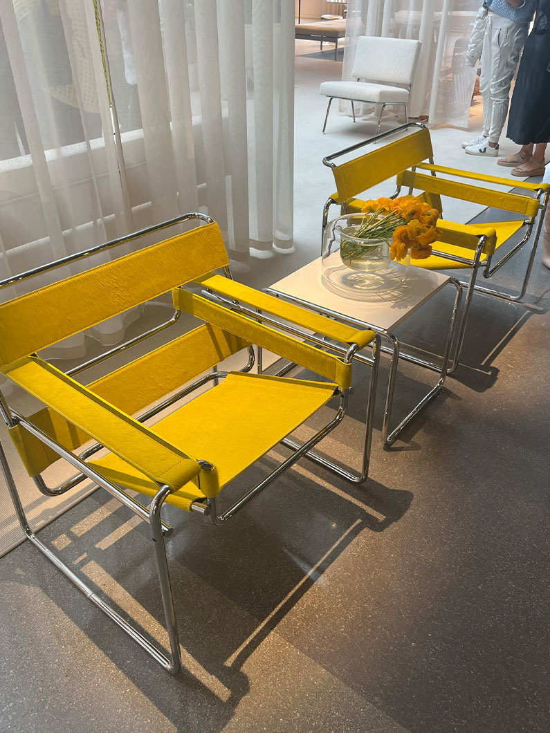 Yellow leather chairs with metal frames at Neocon showroom