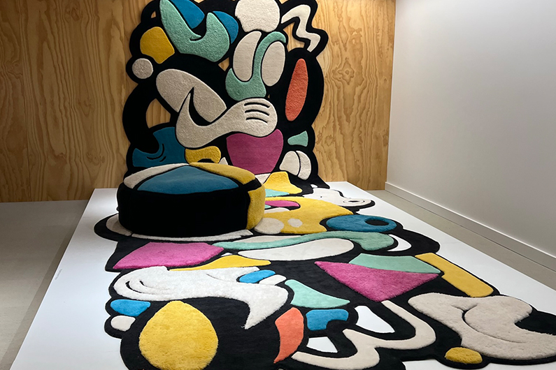 Colorful carpet wall art installation at Neocon