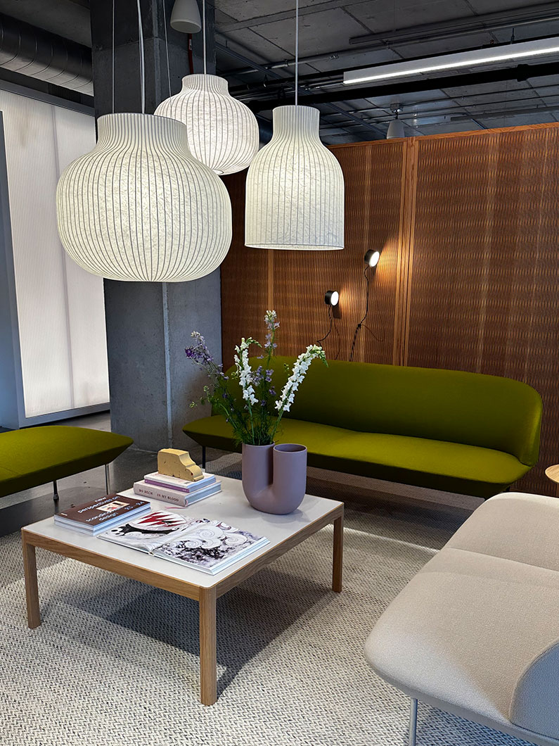 Lighting pendants, couches and table at Neocon showroom