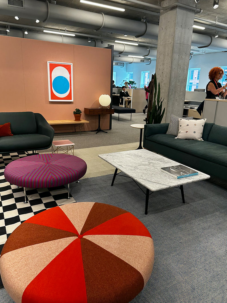 Various colorful furniture pieces and wall art at Neocon 2023