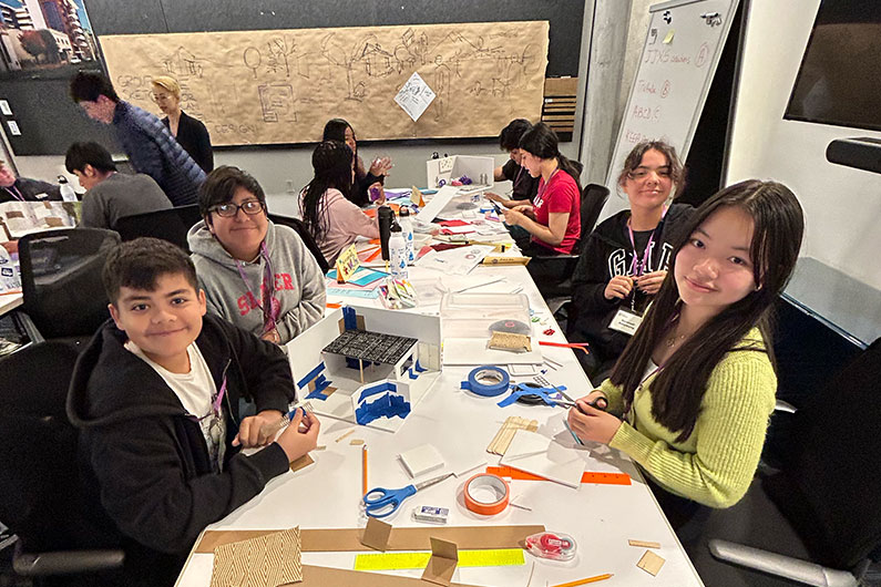 STEM students at TLCD's office for summer program