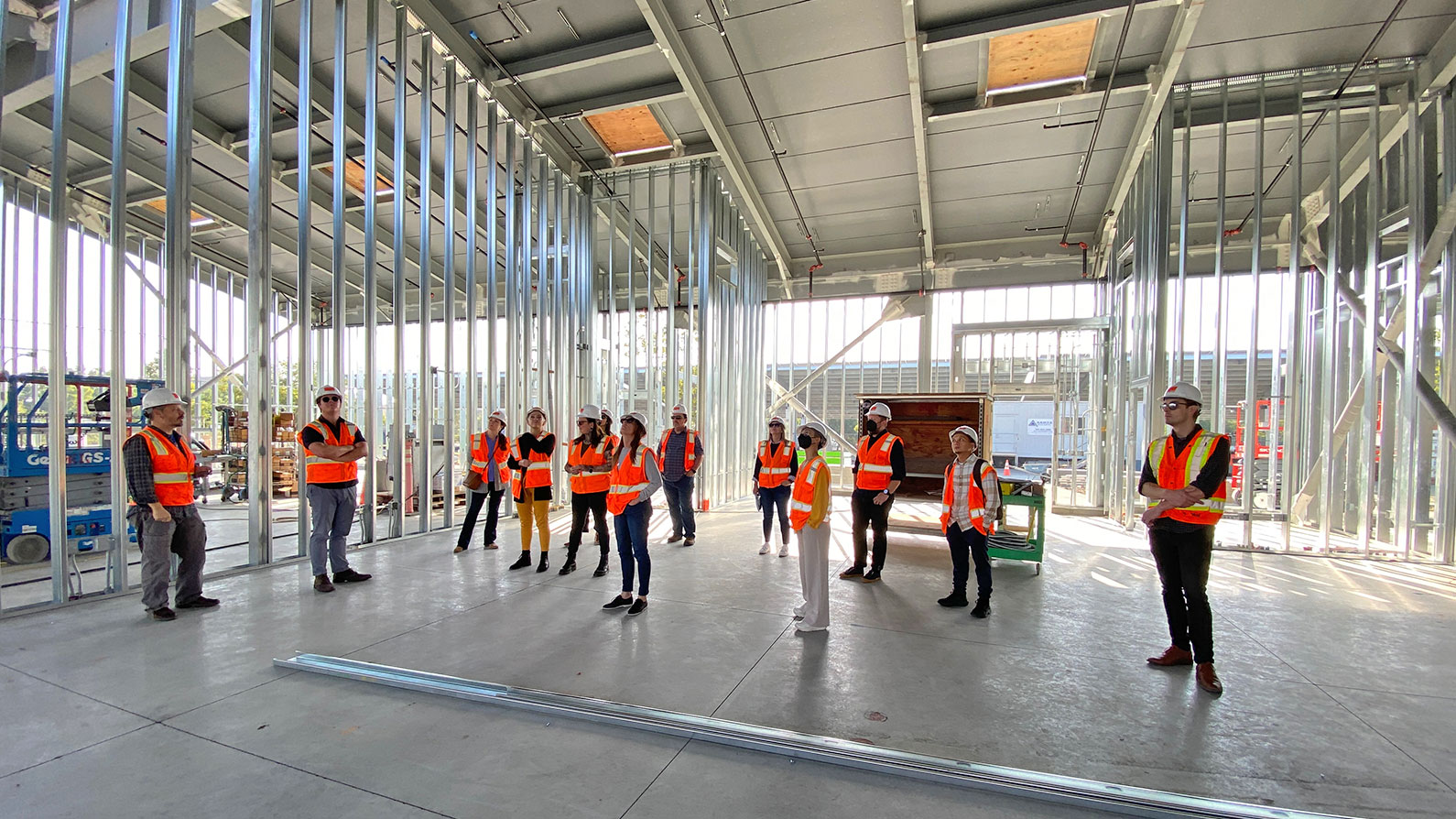 TLCD Team standing inside Construction training Center currently under construction
