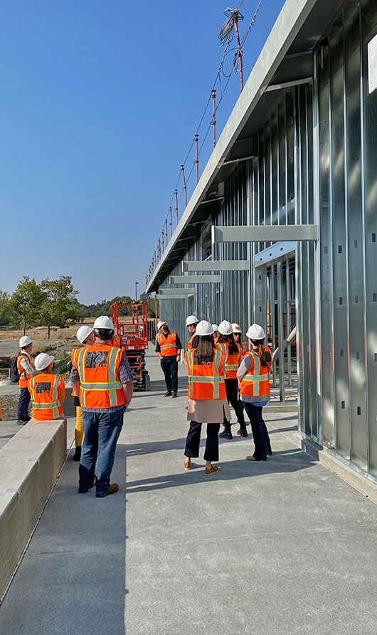 TLCD staff wearing orange construction vests at the entrance to SRJC Construction Center