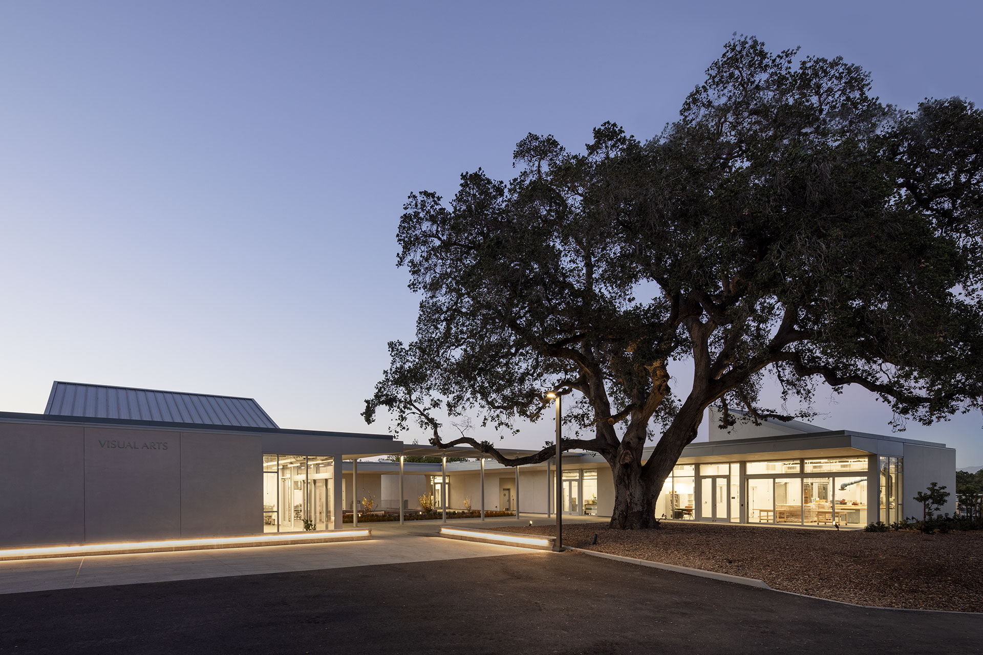 Dusk photo of oak tree and quad at West Valley College Visual Arts Building