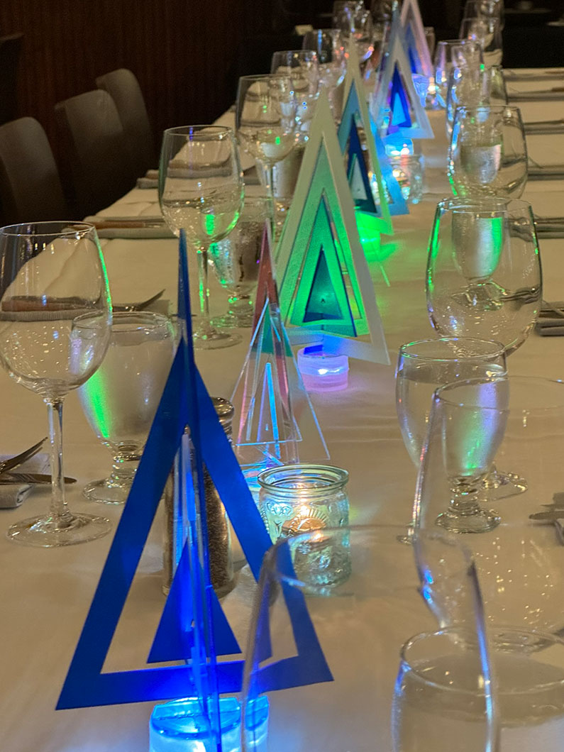 Acrylic holiday centerpieces on table at TLCD holiday party