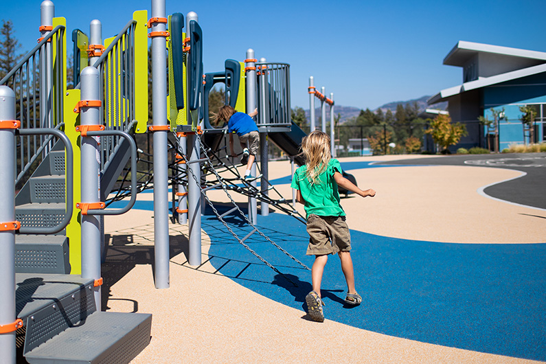 Kindergarten playground with building in background at Irene Snow Elementary School