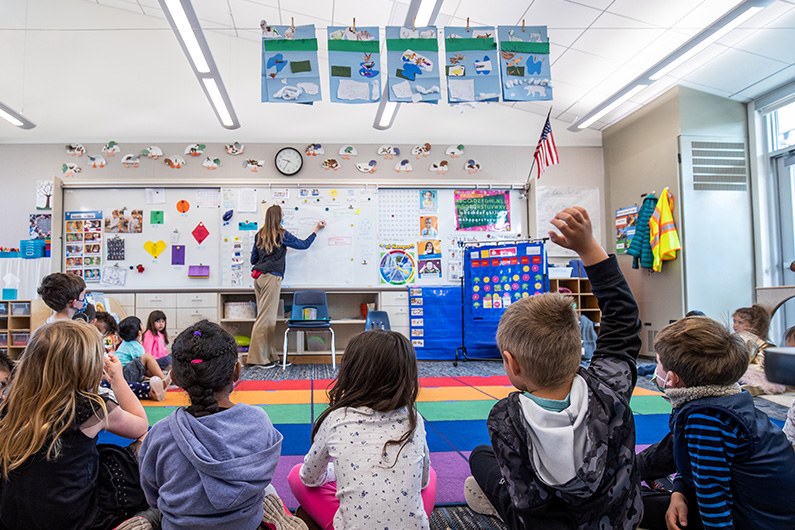 Teacher at whiteboard in side classroom at Loma Vista Immersion Academy