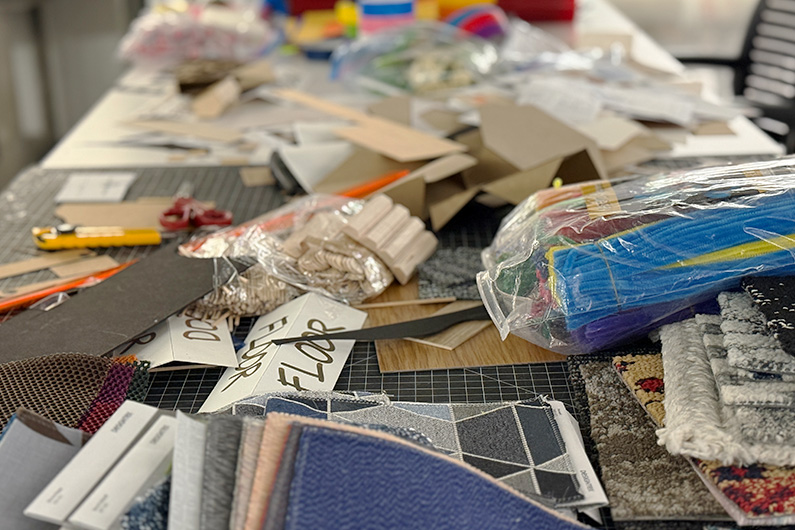 Close up of table full of materials and items for fabricating design space