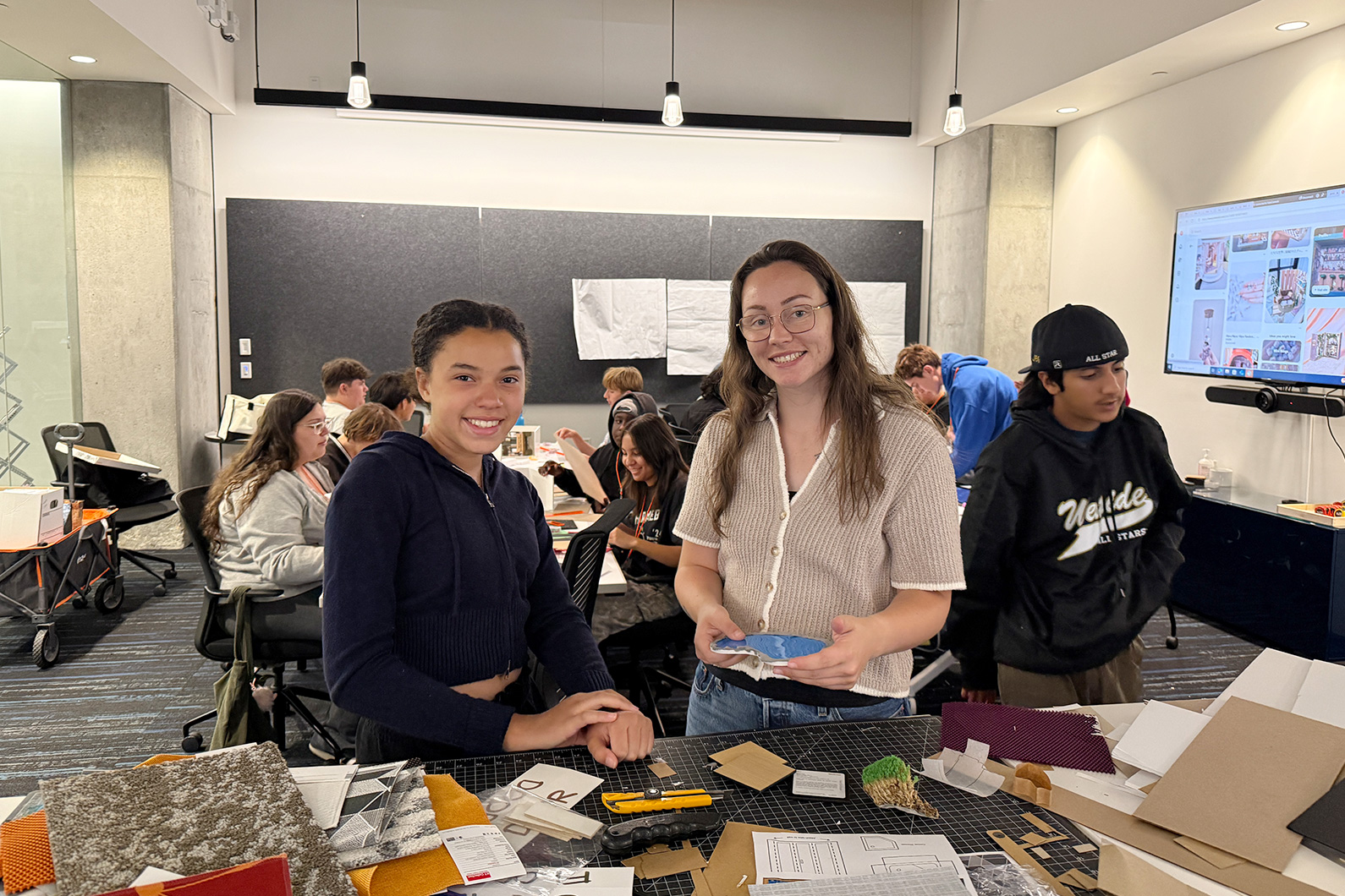 Teacher and student selecting materials for project - Mike Hauser STEM Academy
