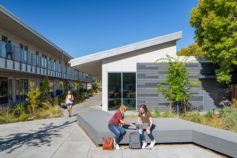 Exterior photo of two buildings and seating areas at SRJC Jeff Kunde Hall