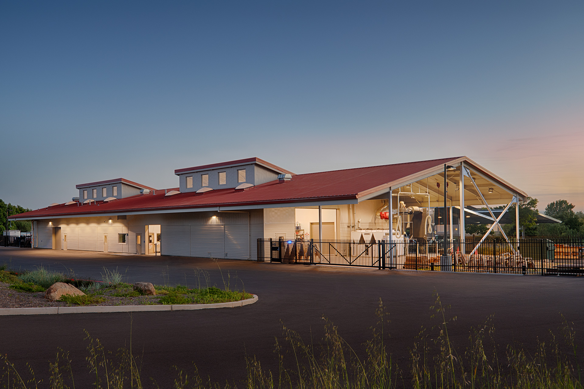 Dusk exterior photo of SRJC Construction Training Center with lights on inside building