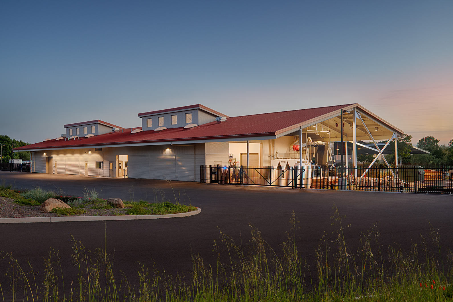 Dusk exterior photo of SRJC Construction Training Center with building illuminated