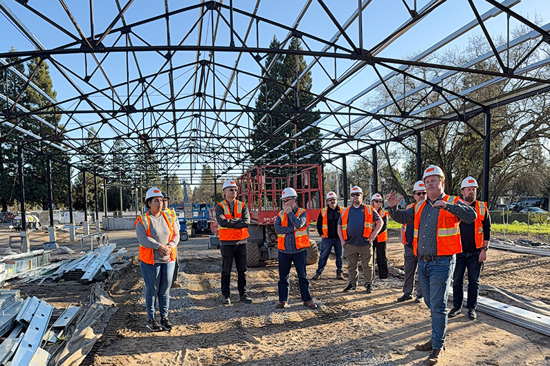 TLCD team wearing hart hats at site tour at Foley Family Community Pavilion in Healdsburg