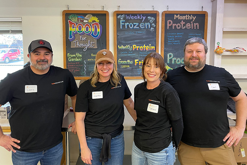 4 TLCD staff volunteering at Food 4 Thought