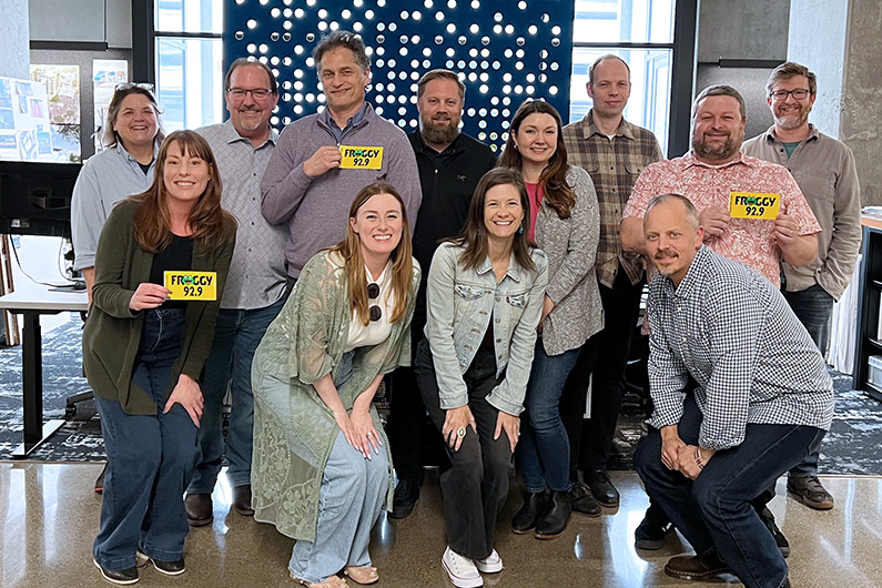 TLCD team won a free Friday lunch from Froggy radio and posed for photo