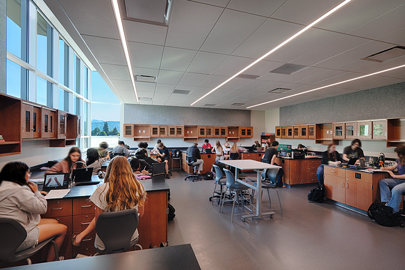 Interior photo of chemistry classroom with students seated in groups