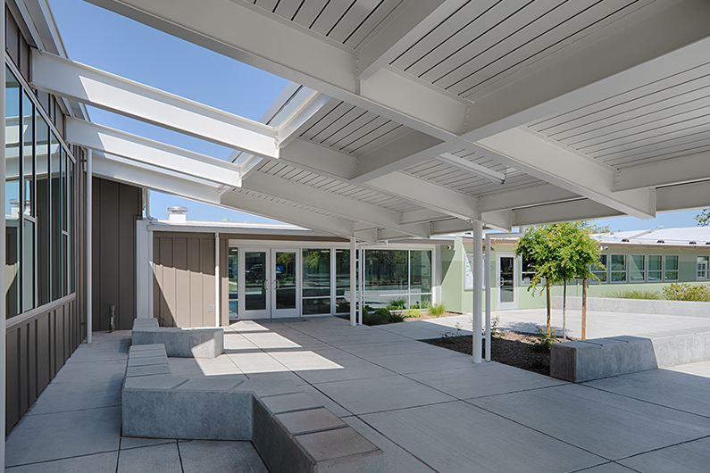 Detail of shed roof that extends to create shaded areas for students